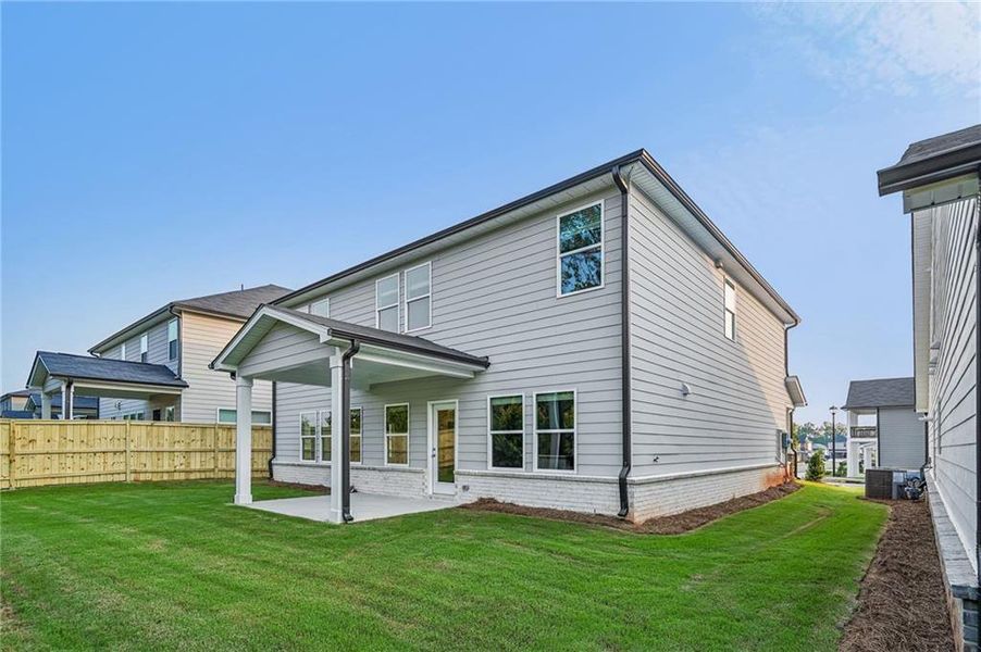 Exterior details and patio area of a home in Martin Springs - Estate Series, Lawrenceville (Image 3).