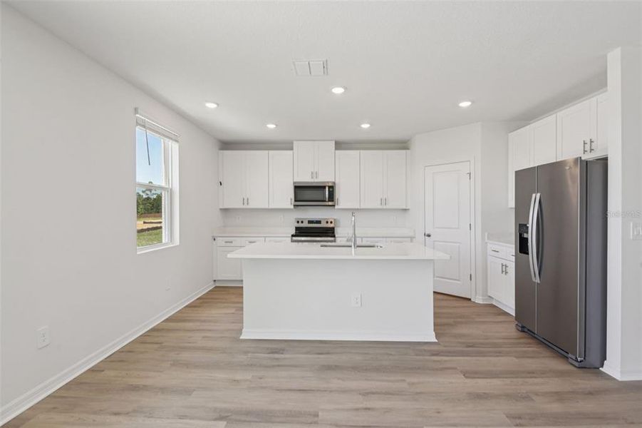 Furnished interior view inside a new home in Hilltop Vistas, Dade City (Image 6).