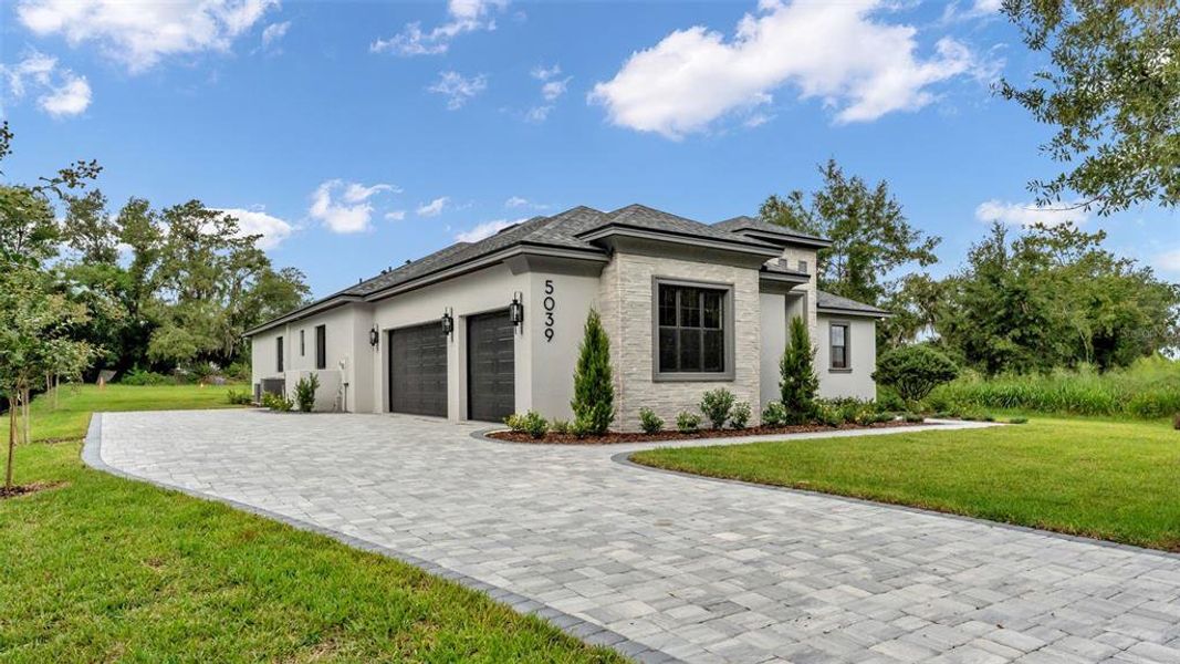 Front exterior of a new home in , Lakeland, FL, highlighting curb appeal (Image 27). Front exterior of a new home in , Lakeland, FL, highlighting curb appeal (Image 27).