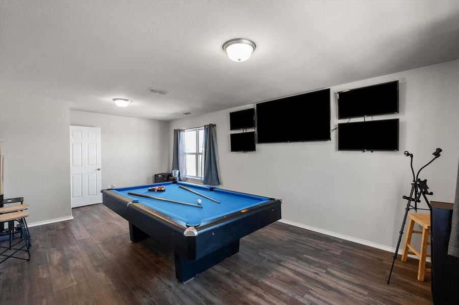 Playroom featuring dark wood-type flooring and billiards