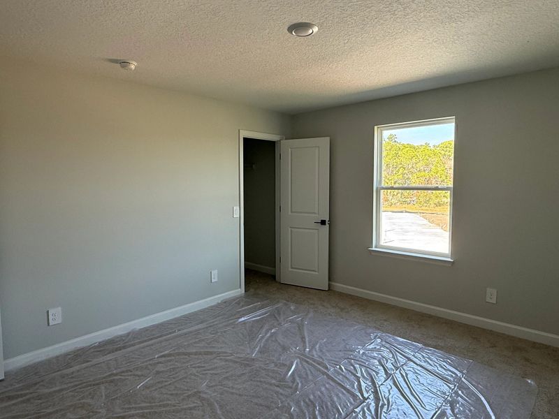 Bedroom 4 features a spacious walk-in closet