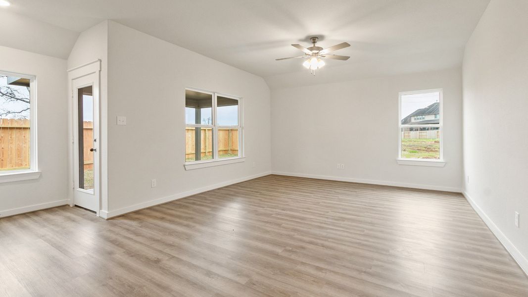 Representative furnished interior of a home built from the Driskill by Brightland Homes in Sunterra, Katy (Image 7).