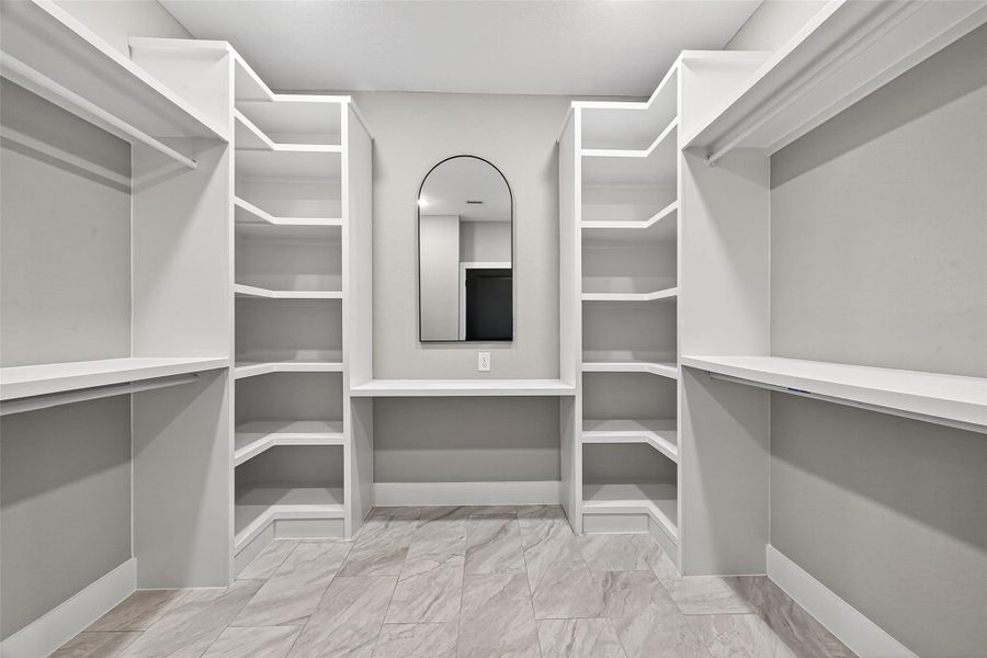 eautiful walk in closet with lots of build-in storages eautiful walk in closet with lots of build-in storages