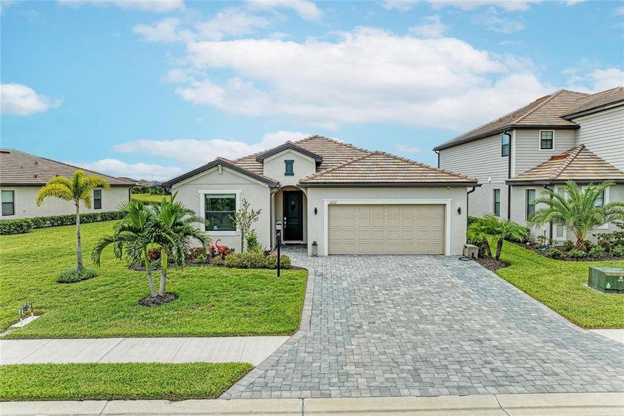 Front exterior of a new home in , Lakewood Ranch, FL, highlighting curb appeal (Image 2). Front exterior of a new home in , Lakewood Ranch, FL, highlighting curb appeal (Image 2).