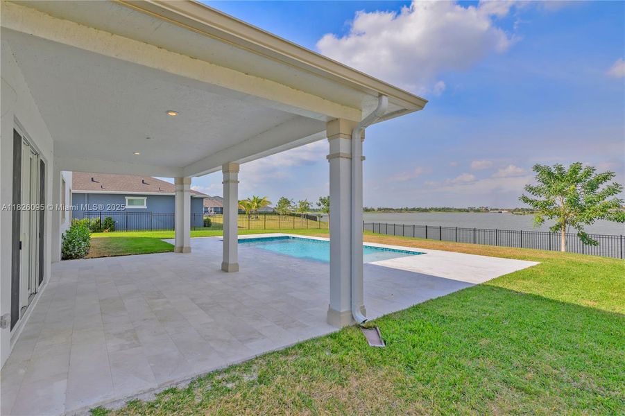Exterior details and patio area of a home in Arden: The Waterford Collection, Loxahatchee (Image 34).