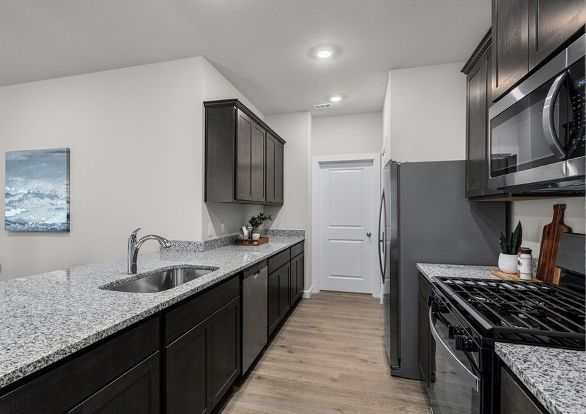 The kitchen has plenty of cabinet space for storage. The kitchen has plenty of cabinet space for storage.