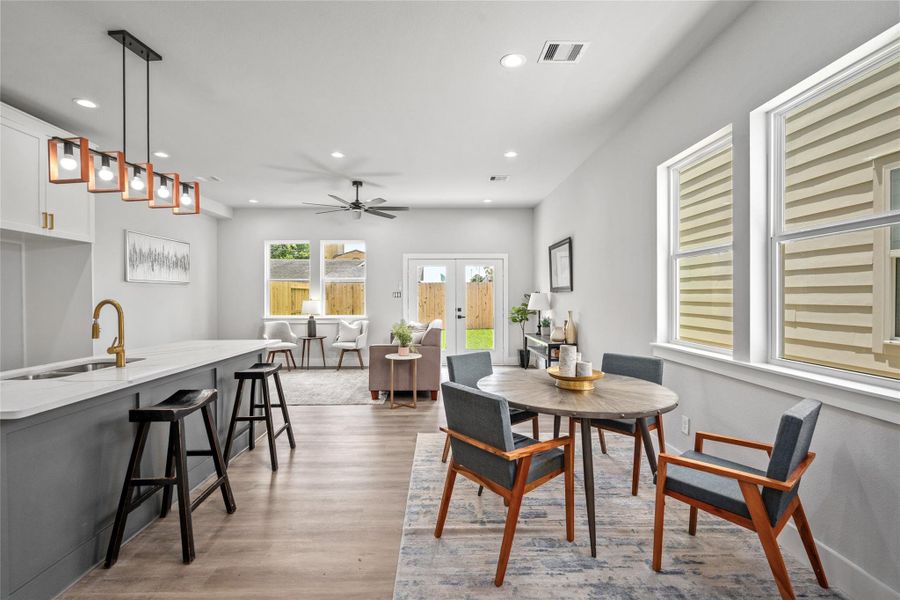 Tons of Natural Lighting coming in from glass door with view to back yard