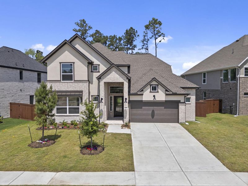 Front exterior of a new home in Evergreen, Conroe, TX, highlighting curb appeal (Image 25).