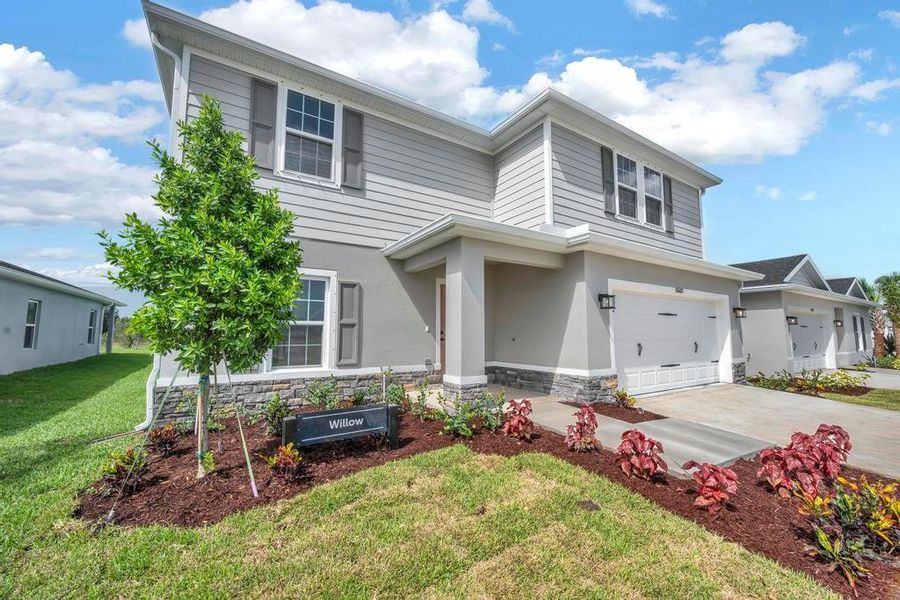 Front exterior of a home in the Terra Lago community, located in Indiantown, FL (Image 10).