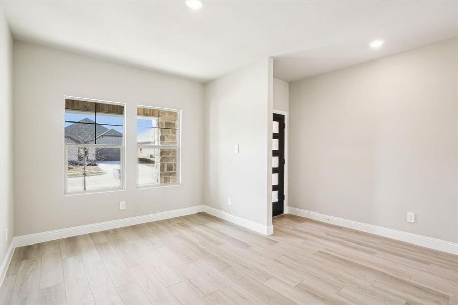 Spare room featuring recessed lighting and light wood-style floors Spare room featuring recessed lighting and light wood-style floors