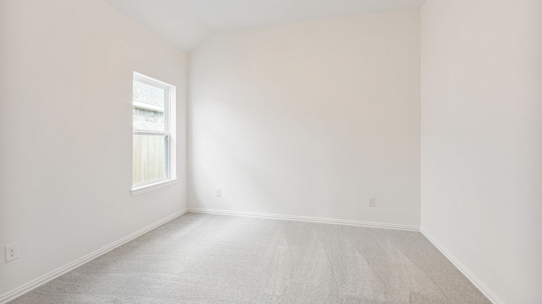 Furnished interior view inside a new home in Creekhaven, Iowa Colony (Image 8).