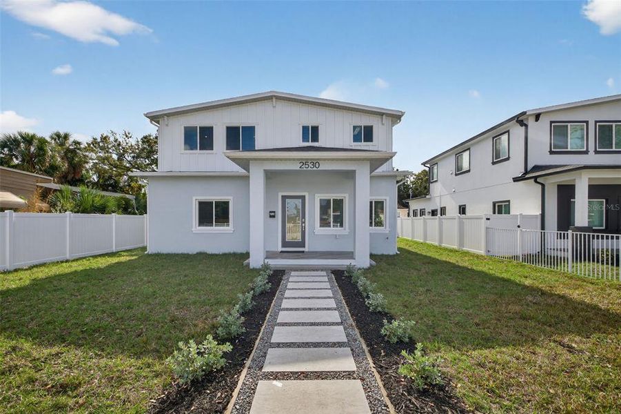 Front exterior of a new home in , St. Petersburg, FL, highlighting curb appeal (Image 1). Front exterior of a new home in , St. Petersburg, FL, highlighting curb appeal (Image 1).