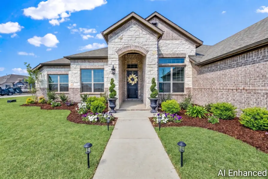 Front exterior of a new home in Berkshire Estates, Mesquite, TX, highlighting curb appeal (Image 22).