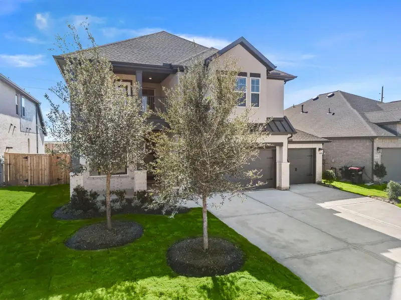 Front exterior of a new home in , Fulshear, TX, highlighting curb appeal (Image 1). Front exterior of a new home in , Fulshear, TX, highlighting curb appeal (Image 1).