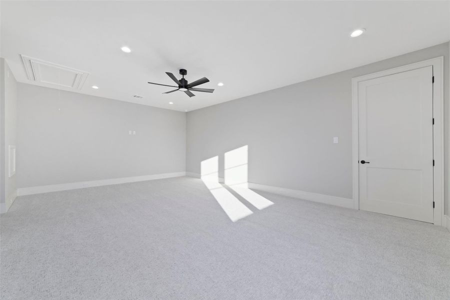 Large flexible upstairs space ideal for media, recreation, or lounge space.