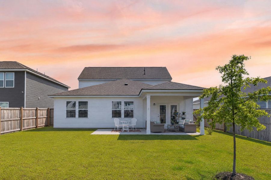 Exterior details and patio area of a home in Sanctuary Cove at Cane Bay, Summerville (Image 4).