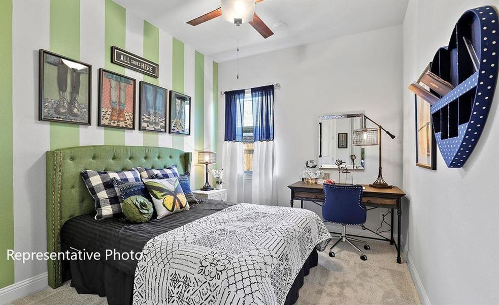 Carpeted bedroom with baseboards and a ceiling fan