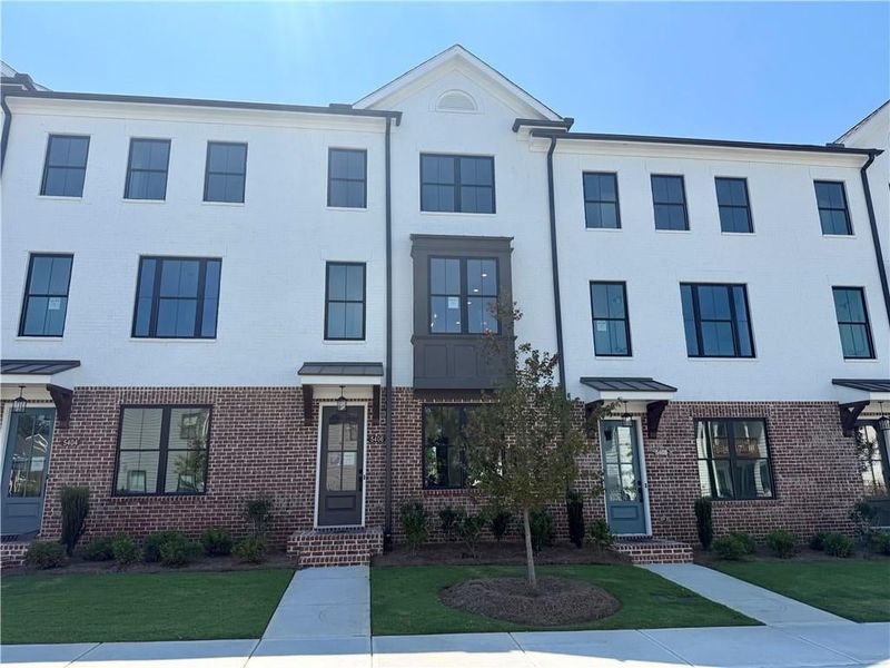 Contemporary brick and stucco exterior with multiple windows Contemporary brick and stucco exterior with multiple windows