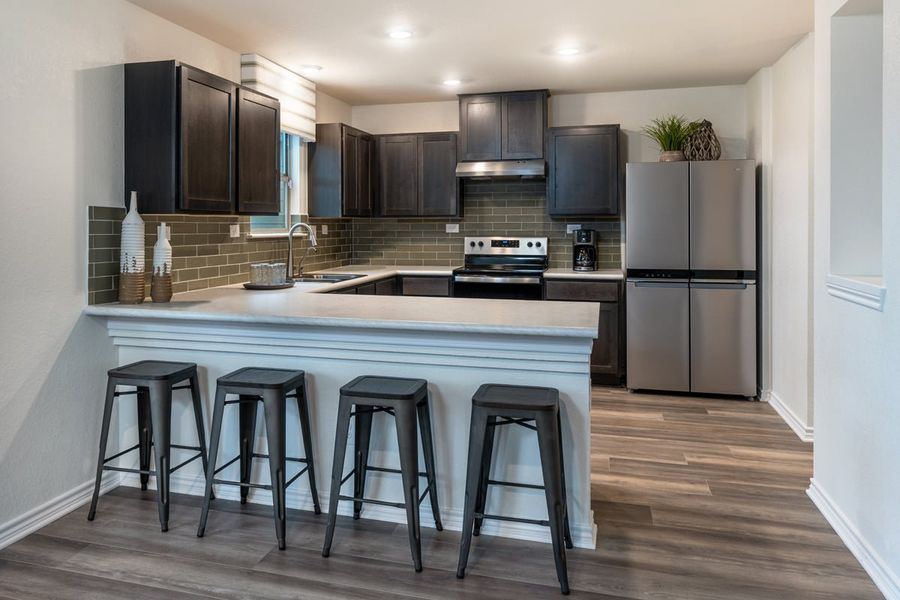 Representative furnished interior of a home built from the 2100 by KB Home in Spanish Trails, San Antonio (Image 4).