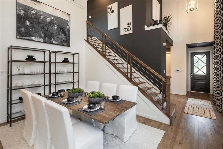 Two story ceilings in the dining room (Representative)