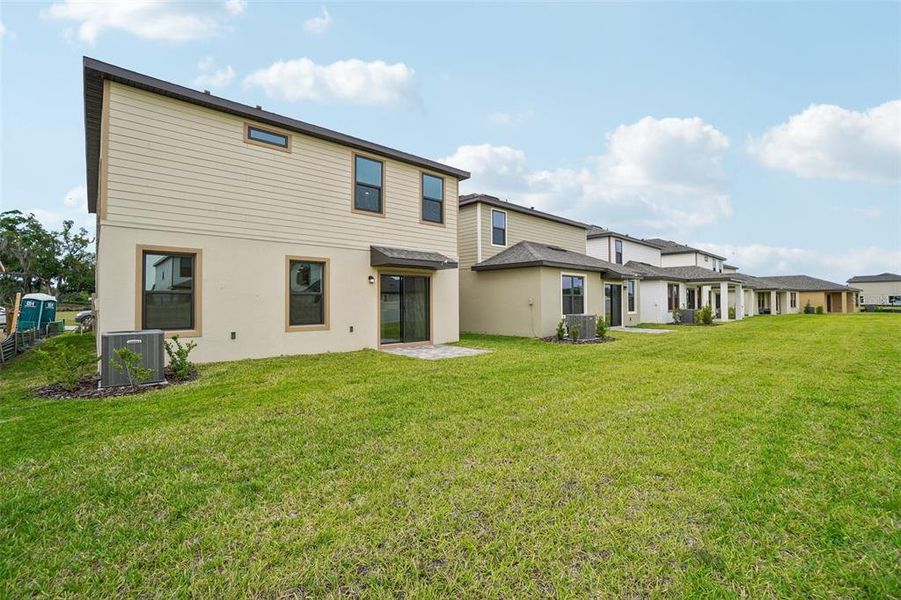 Exterior details and patio area of a home in Grasslands West, Lakeland (Image 24).