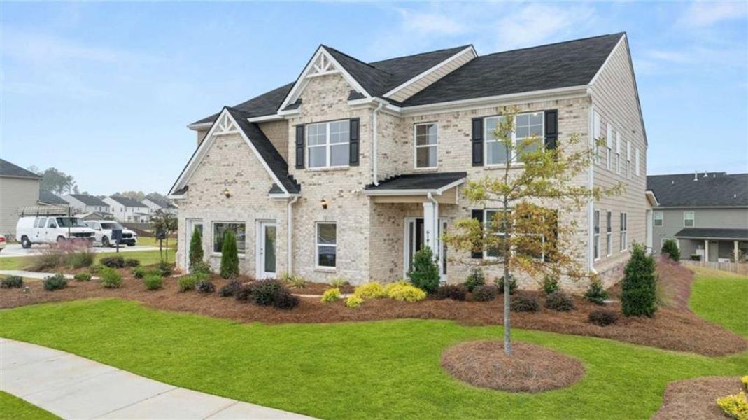 Front exterior of a new home in The Gates at Pates Creek, Hampton, GA, highlighting curb appeal (Image 21).