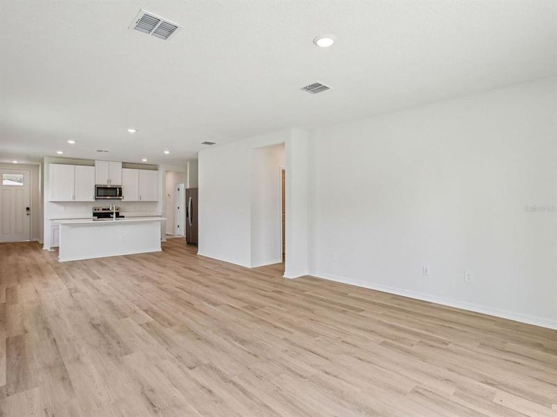 Spacious, unfurnished interior of a new home in The Grove at Stuart Crossing - Premier Series, Bartow (Image 13).