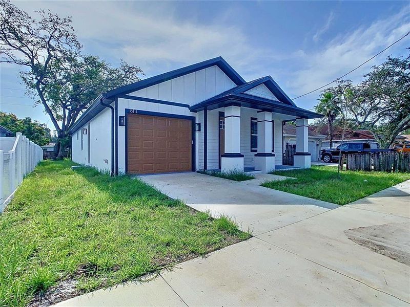 Front exterior of a new home in , Tampa, FL, highlighting curb appeal (Image 16). Front exterior of a new home in , Tampa, FL, highlighting curb appeal (Image 16).