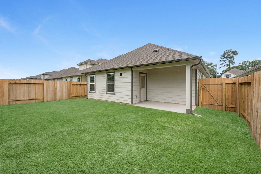 Exterior details and patio area of a home in Cypresswood Landing, Humble (Image 4).