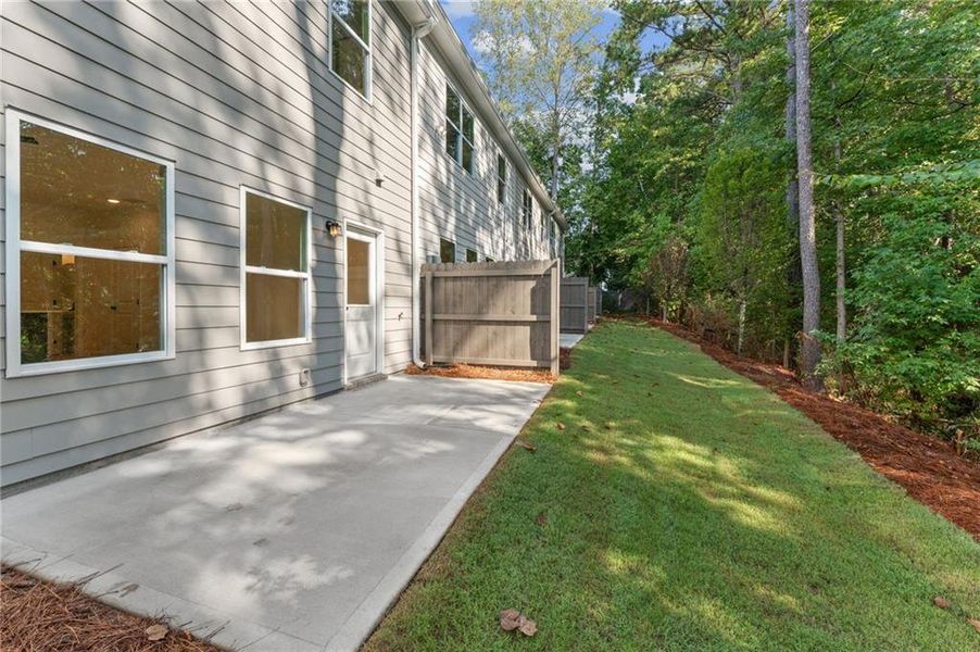 Exterior details and patio area of a home in River Walk Place, Lawrenceville (Image 18).