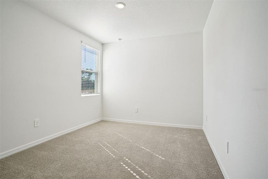 Spacious, unfurnished interior of a new home in Ridgehaven - Villas, Ormond Beach (Image 35).