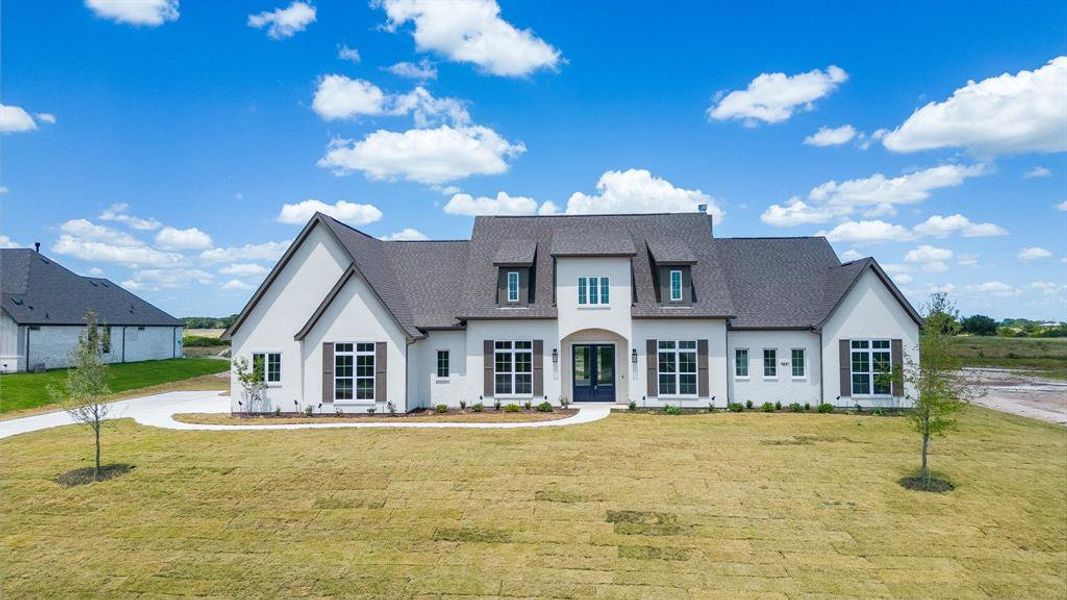 View of front of home with a front yard