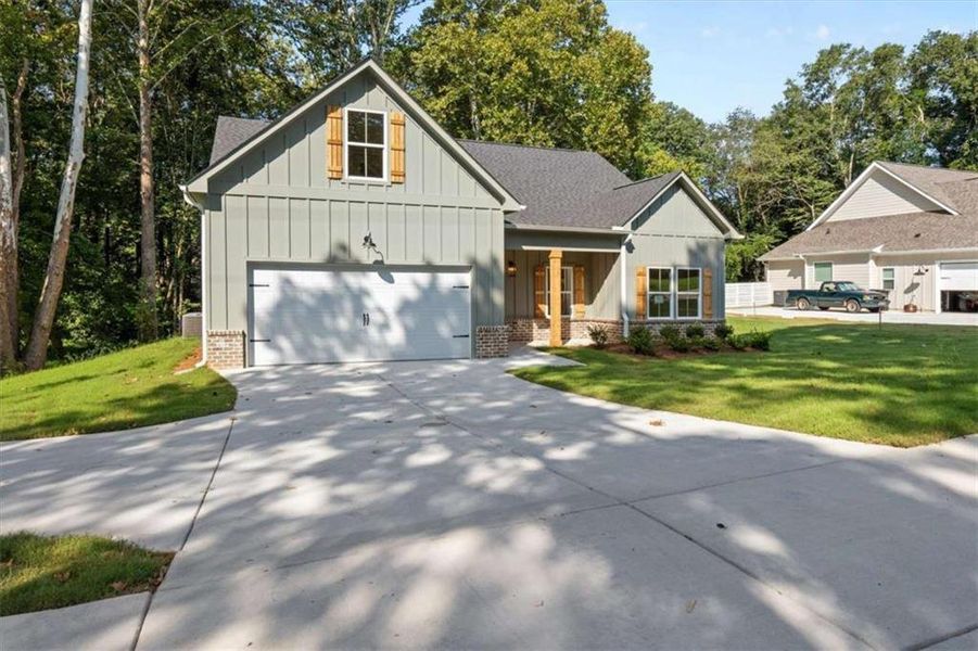 Front exterior of a new home in , Temple, GA, highlighting curb appeal (Image 19).