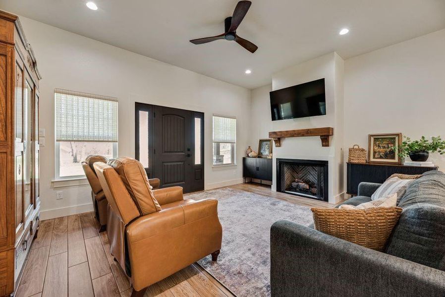 Amazing Living room with Stone fireplace, gas starter logs, and custom firebox that looks like a piece of artwork! 
Custom fabricated mantle and 10 foot ceilings