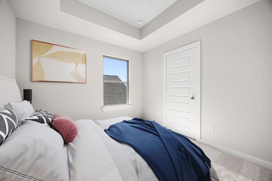 This secondary bedroom also features an elegant tray ceiling with recessed lighting, custom paint, plush carpet, large window, and an ample sized closet. *Virtually Staged This secondary bedroom also features an elegant tray ceiling with recessed lighting, custom paint, plush carpet, large window, and an ample sized closet. *Virtually Staged