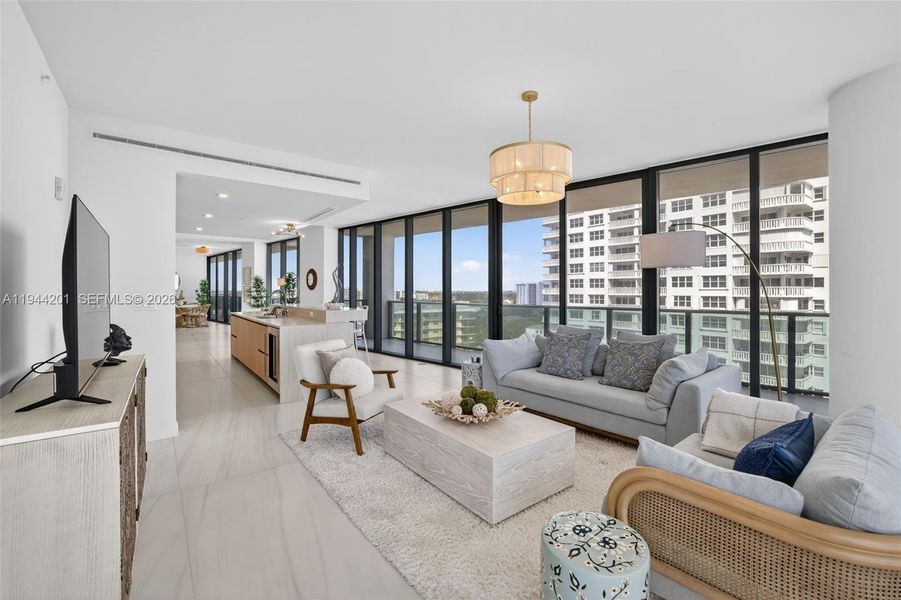 Light filled open living area with floor to ceiling glass and seamless indoor outdoor flow to expansive terrace.