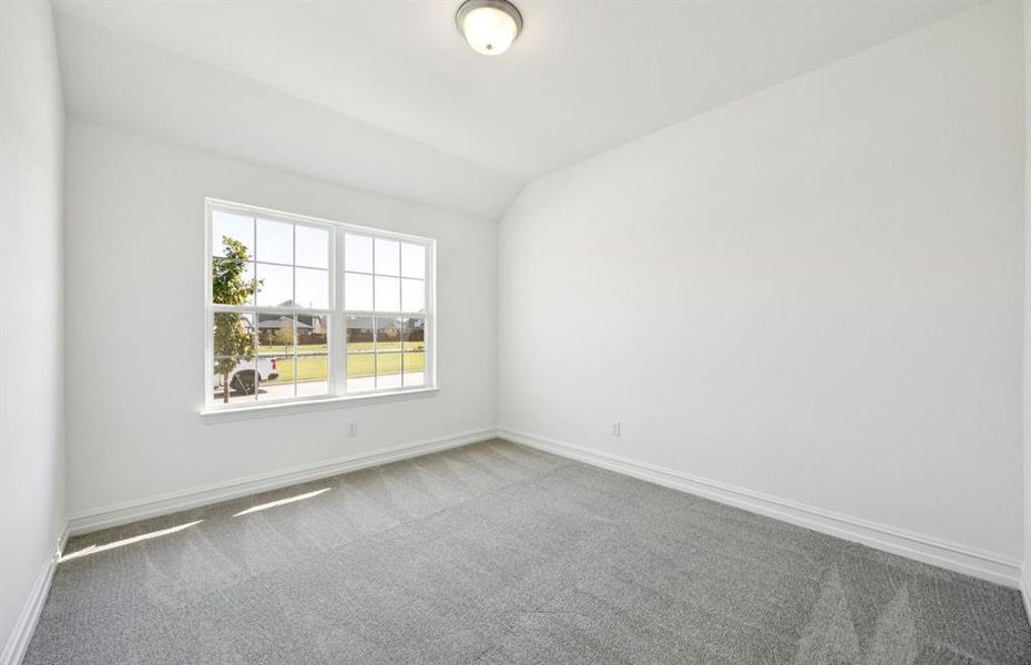 Spacious secondary bedroom with large windows