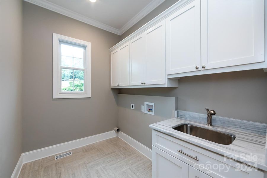 Laundry Room Photo is a representation of builders work on Completion of Home Next Door