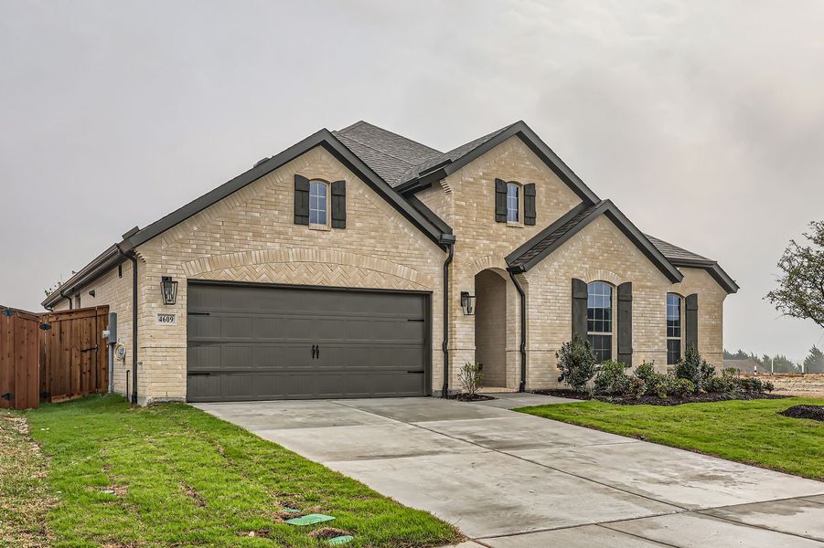 Front exterior of a new home in BridgeWater 60s, Midlothian, TX, highlighting curb appeal (Image 2). Front exterior of a new home in BridgeWater 60s, Midlothian, TX, highlighting curb appeal (Image 2).