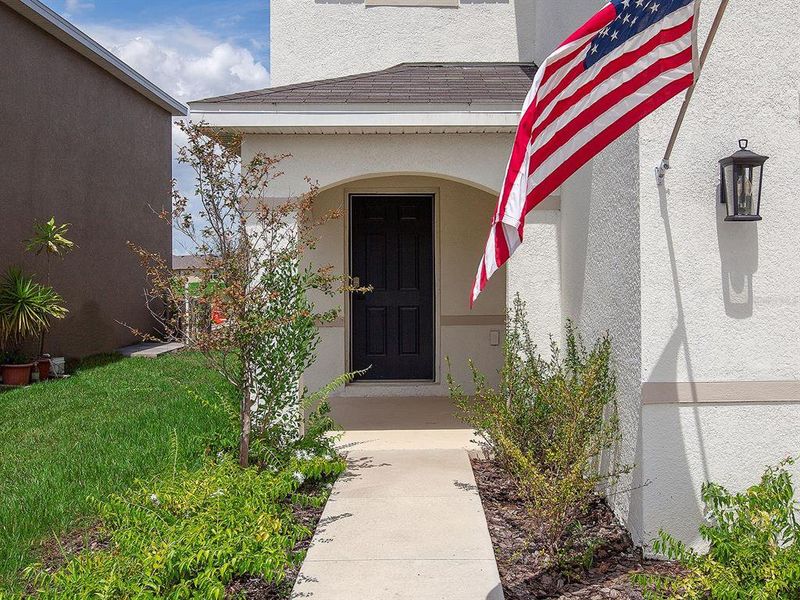 Front exterior of a new home in , Bradenton, FL, highlighting curb appeal (Image 22).