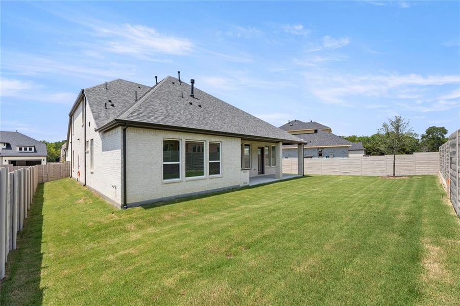 Front exterior of a new home in Painted Tree Woodlands, McKinney, TX, highlighting curb appeal (Image 24).