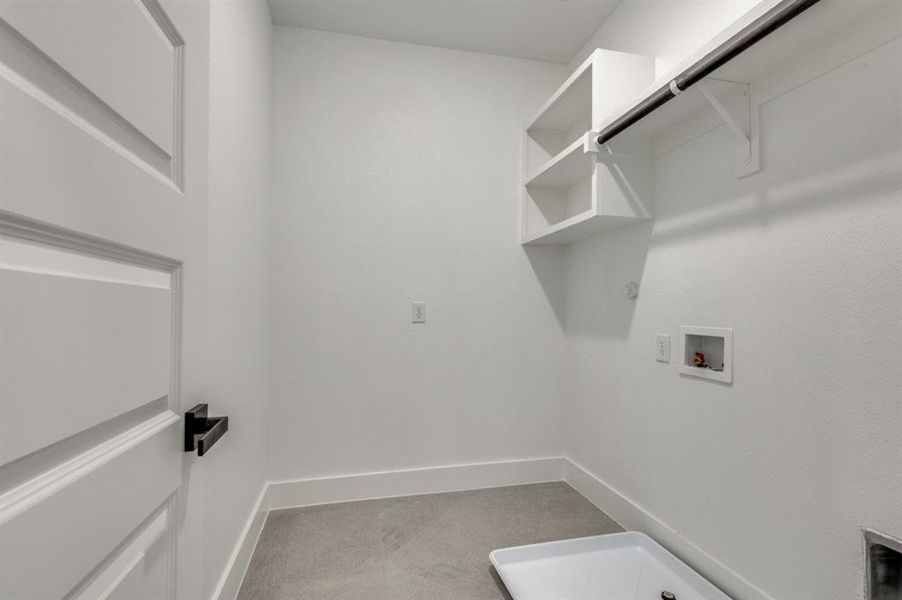 Clothes washing area featuring washer hookup, carpet floors, and hookup for a gas dryer