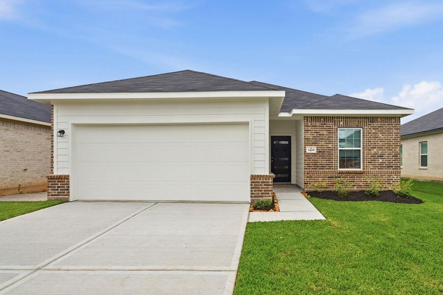 Front exterior of a new home in Steed Landing, Texas City, TX, highlighting curb appeal (Image 1). Front exterior of a new home in Steed Landing, Texas City, TX, highlighting curb appeal (Image 1).