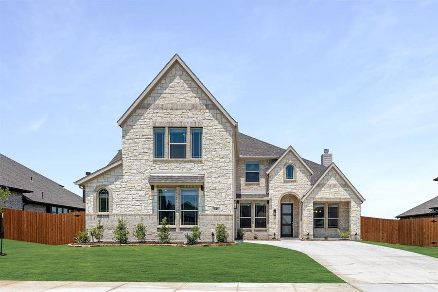 Front exterior of a new home in Sunrise at Garden Valley 60-79, Waxahachie, TX, highlighting curb appeal (Image 23). Front exterior of a new home in Sunrise at Garden Valley 60-79, Waxahachie, TX, highlighting curb appeal (Image 23).
