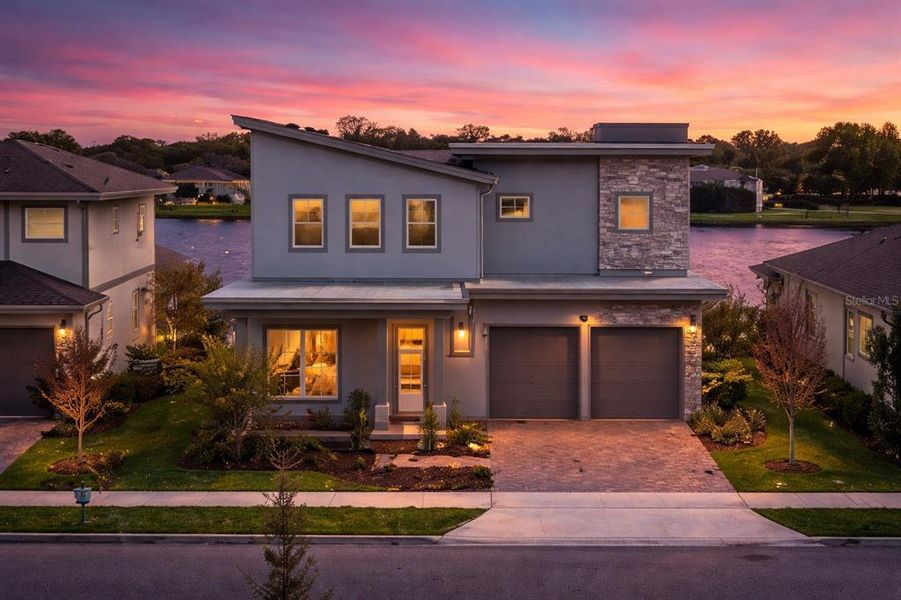 Front exterior of a new home in Laureate Park, Orlando, FL, highlighting curb appeal (Image 24).