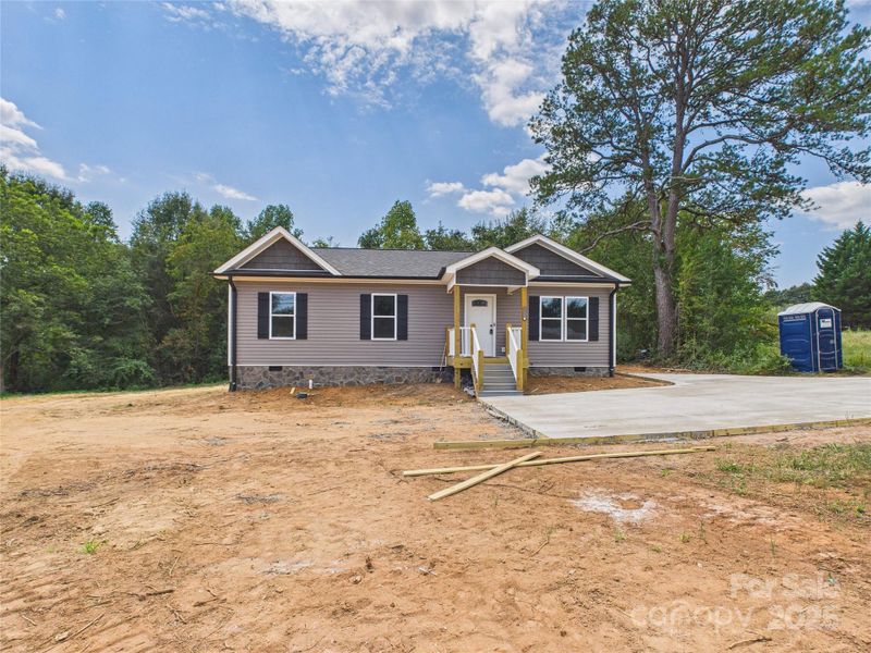 Front exterior of a new home in , Connelly Springs, NC, highlighting curb appeal (Image 16). Front exterior of a new home in , Connelly Springs, NC, highlighting curb appeal (Image 16).