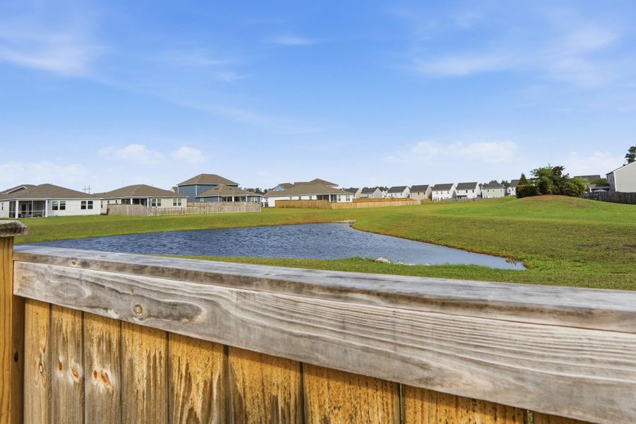 Exterior details and patio area of a home in Sanctuary Cove at Cane Bay, Summerville (Image 30).