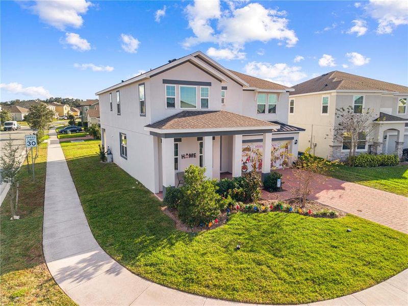 Front exterior of a new home in , St. Cloud, FL, highlighting curb appeal (Image 26).