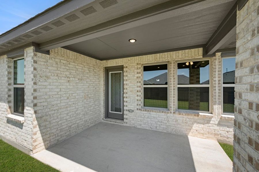 Representative exterior photo of a completed home built from the Austin by Impression Homes in Baker Farms, Cleburne, TX (Image 24).