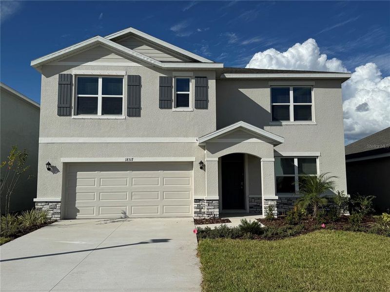 Front exterior of a new home in Solera at Lakewood Ranch, Lakewood Ranch, FL, highlighting curb appeal (Image 2).